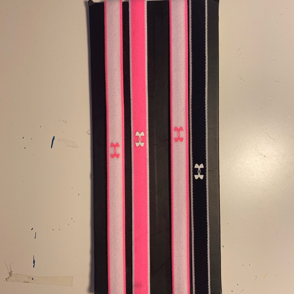 Four multicolor under armour headbands